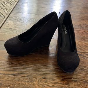 Black suede wedge pump
